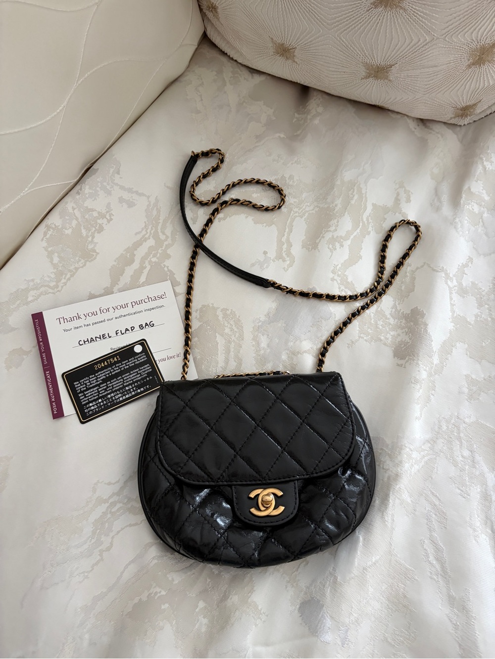 CHANEL Black Quilted Patent Leather Mini Saddle Flap Bag with Gold Chain